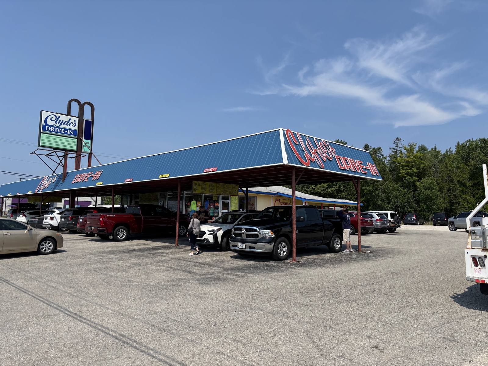 Clyde's Drive-In on US-2: the vintage sign and cars parked under the blue canopy